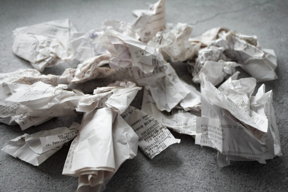 Many crumpled receipts from stores. The concept of shopping, taxes and budget