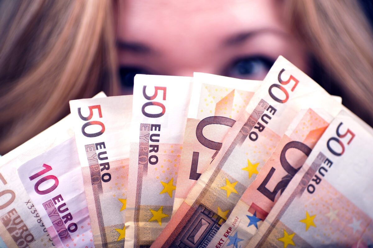 Woman with Euro Cash Money in Her Hands