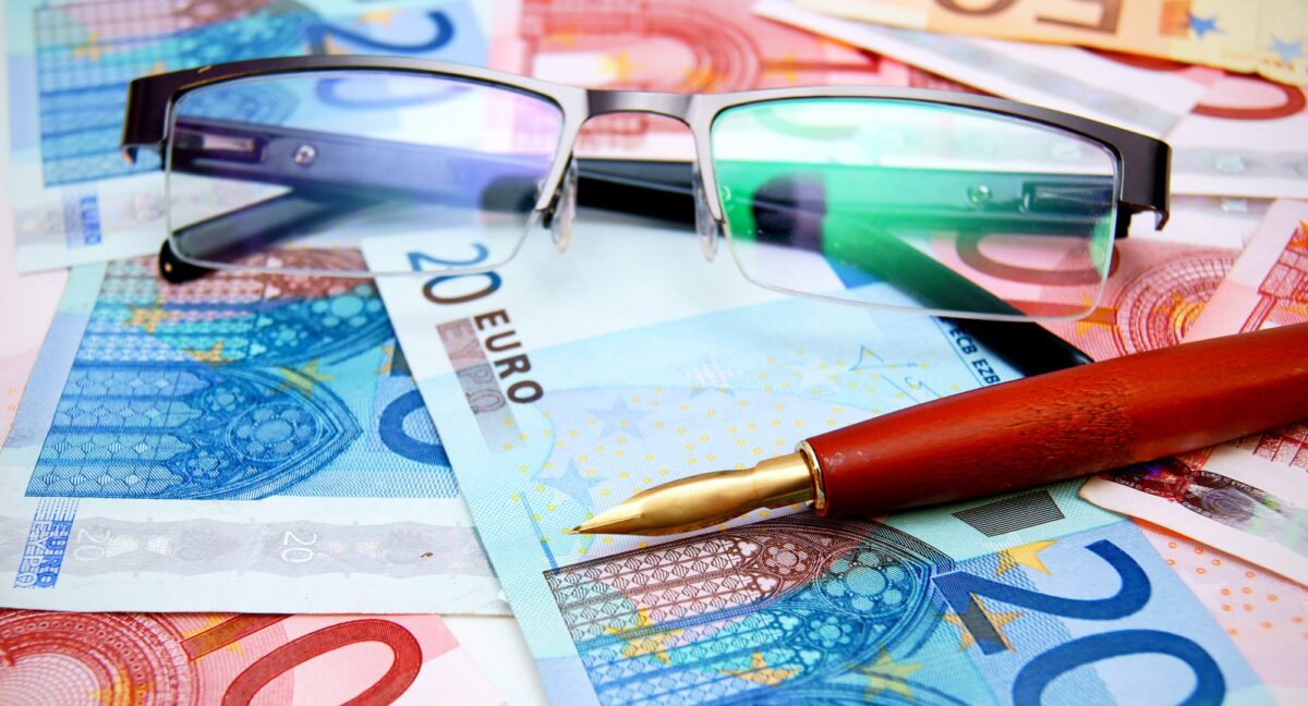 Pen and Glasses on banknotes (euro).